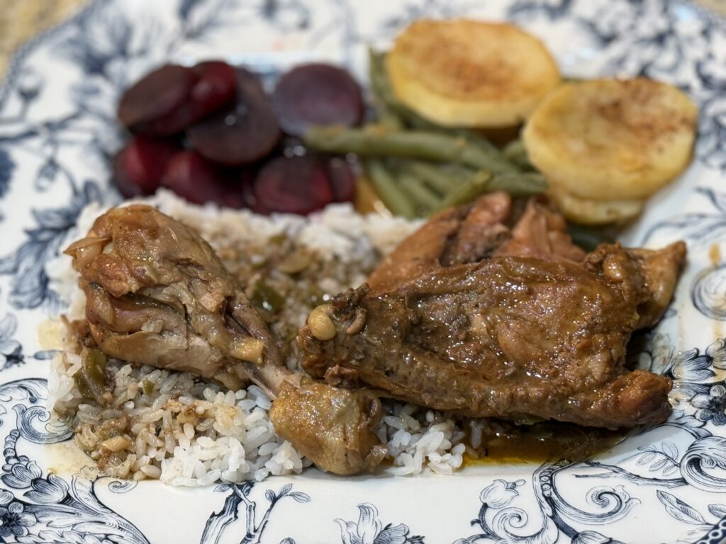 Smothered chicken with rice and gravy, cooked by Charles Dore', beets, greeen beans and yellow squash